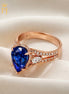 14K rose pear shape blue sapphire and diamond ring