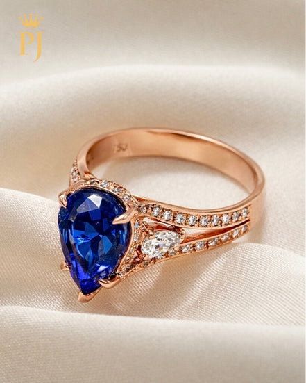 14K rose pear shape blue sapphire and diamond ring