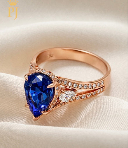14K rose pear shape blue sapphire and diamond ring