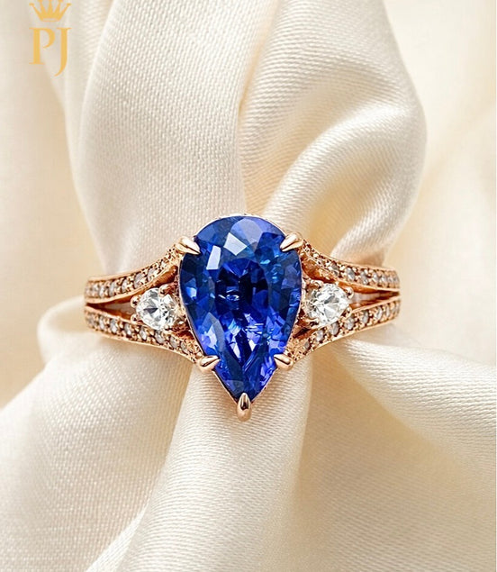14K rose pear shape blue sapphire and diamond ring