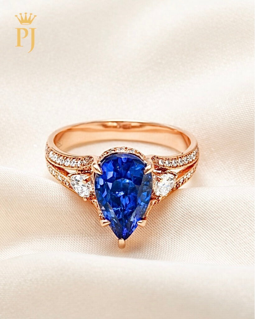 14K rose pear shape blue sapphire and diamond ring