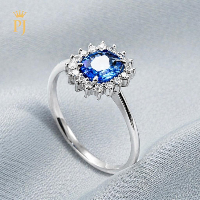 18k white gold blue sapphire and diamond ring
