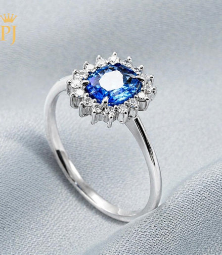 18k white gold blue sapphire and diamond ring