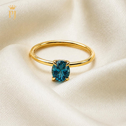 18k yellow gold teal sapphire ring