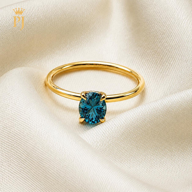 18k yellow gold teal sapphire ring