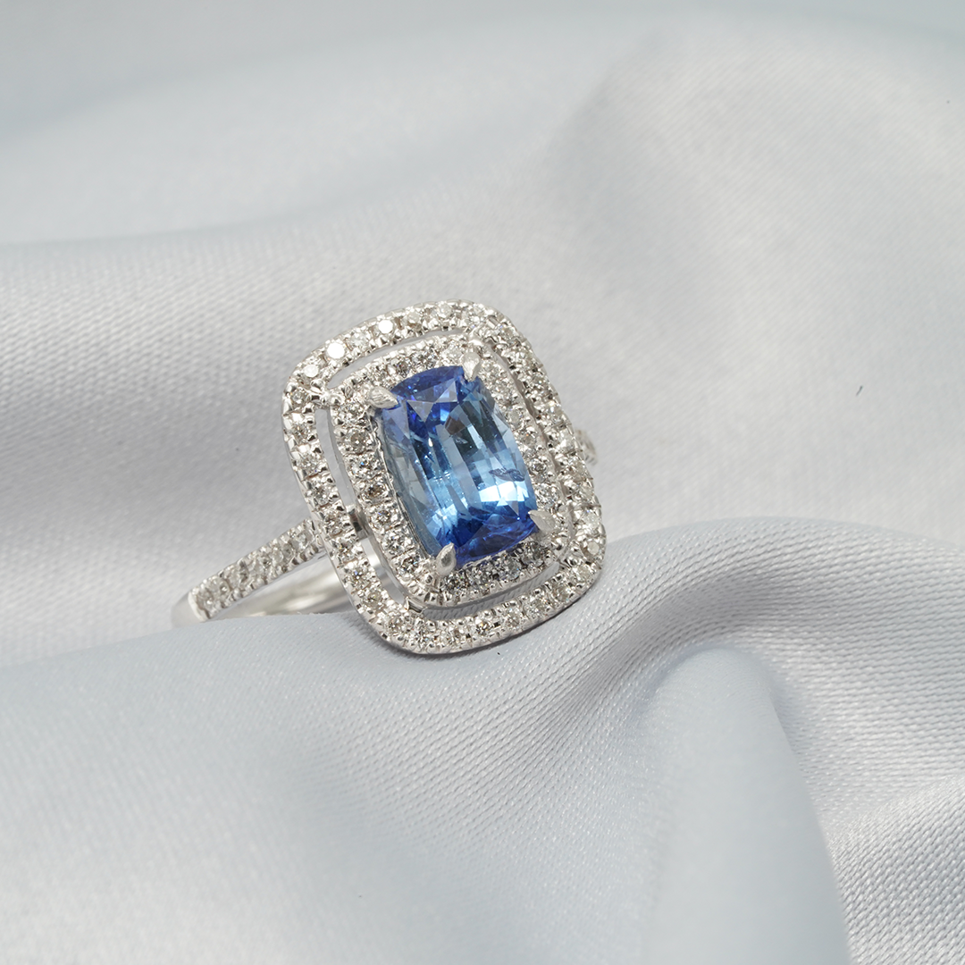 Radiant Elegance – 18K White Gold Blue Sapphire & Diamond Double Halo Ring