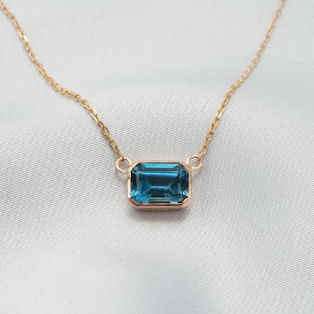 Elegant Emerald-Cut Blue Topaz Necklace in 18K Rose Gold