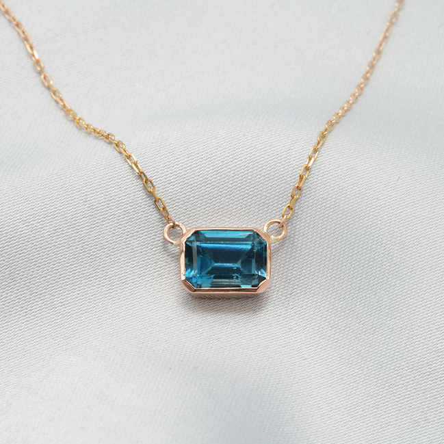 Elegant Emerald-Cut Blue Topaz Necklace in 18K Rose Gold