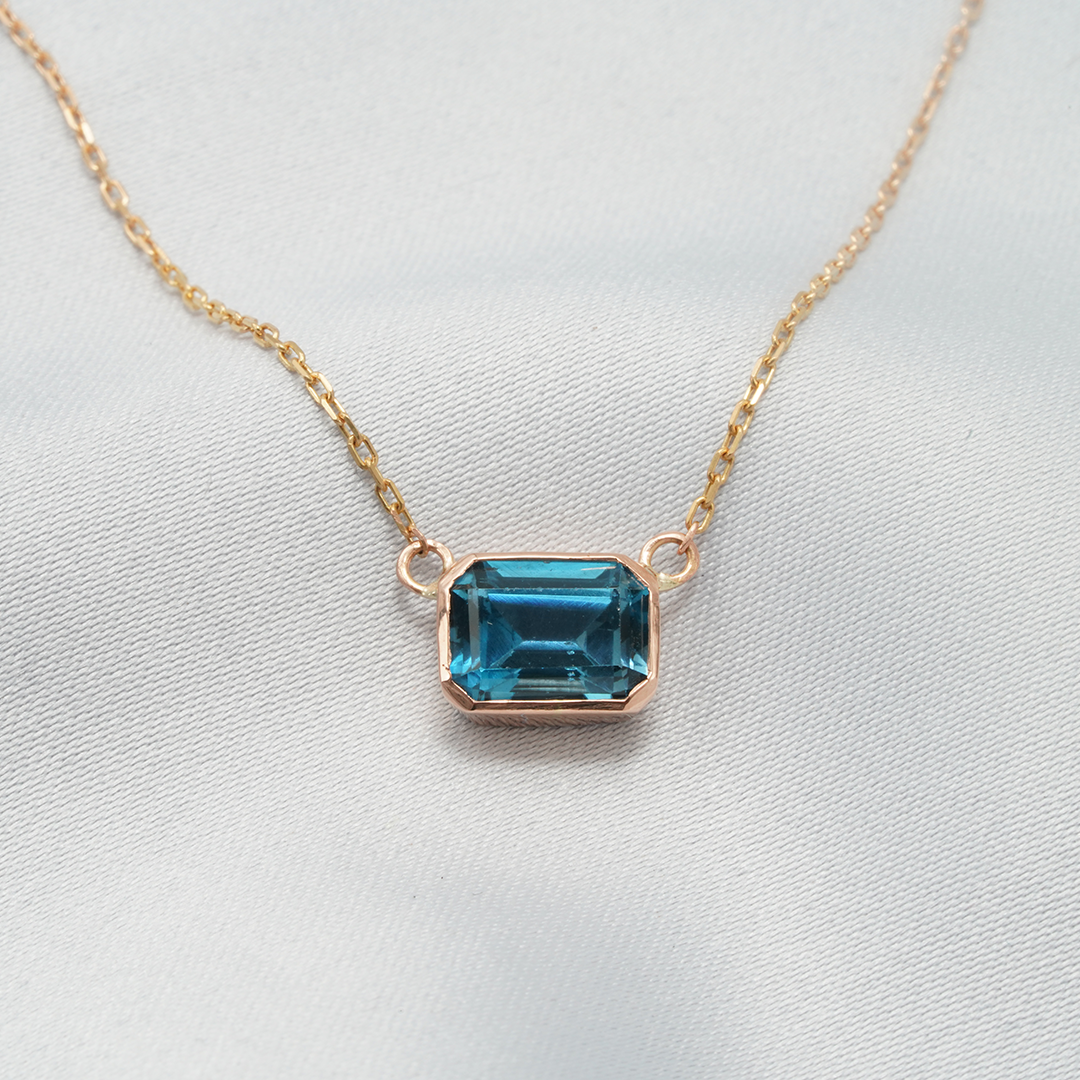 Elegant Emerald-Cut Blue Topaz Necklace in 18K Rose Gold
