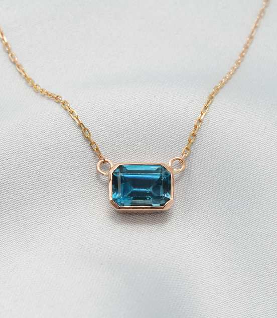 Elegant Emerald-Cut Blue Topaz Necklace in 18K Rose Gold