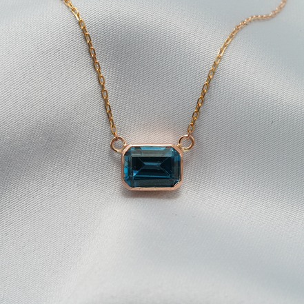 Elegant Emerald-Cut Blue Topaz Necklace in 18K Rose Gold