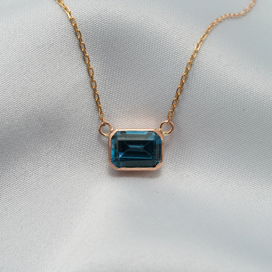 Elegant Emerald-Cut Blue Topaz Necklace in 18K Rose Gold