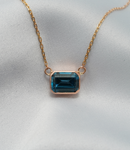 Elegant Emerald-Cut Blue Topaz Necklace in 18K Rose Gold