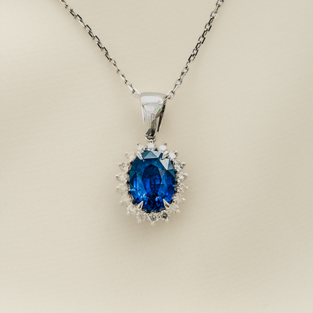 A Blue Jewel in a Crown of Diamonds - Blue Sapphire & Diamond Pendant in 18KT White Gold