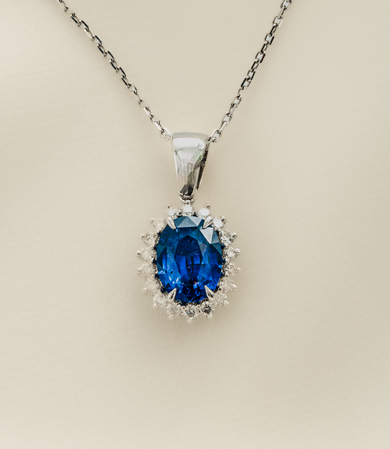 A Blue Jewel in a Crown of Diamonds - Blue Sapphire & Diamond Pendant in 18KT White Gold